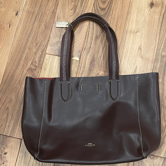 Coach Handbags - Coach Dark Brown Leather Tote With Red Interior.